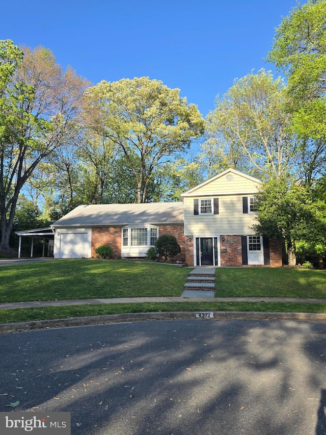 4303 S Valiant Ct, Annandale, VA 22003 - split level home featuring an attached garage, brick siding, a front yard, and a carport