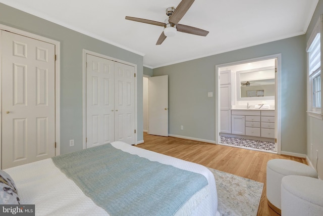 4303 S Valiant Ct, Annandale, VA 22003 - bedroom featuring light wood finished floors, baseboards, crown molding, connected bathroom, and a sink