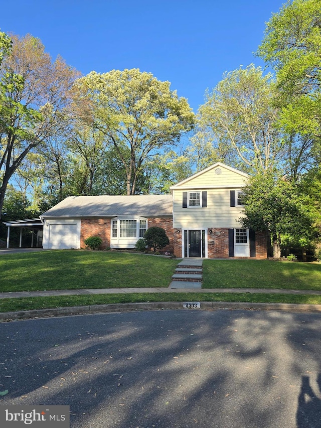 4303 S Valiant Ct, Annandale, VA 22003 - tri-level home with an attached garage, a front lawn, and brick siding