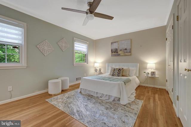 4303 S Valiant Ct, Annandale, VA 22003 - bedroom featuring crown molding, light wood-style flooring, baseboards, and a ceiling fan