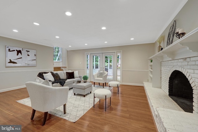 4303 S Valiant Ct, Annandale, VA 22003 - living room featuring healthy amount of natural light, ornamental molding, wood finished floors, a fireplace, and baseboards