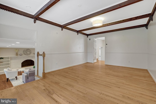4303 S Valiant Ct, Annandale, VA 22003 - unfurnished living room featuring beam ceiling, a fireplace, wood finished floors, and baseboards