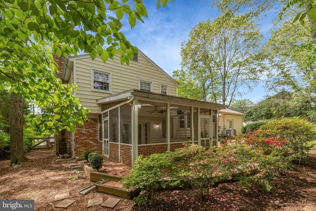 4303 S Valiant Ct, Annandale, VA 22003 - rear view of property with a sunroom, ceiling fan, brick siding, and a chimney