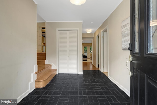 4303 S Valiant Ct, Annandale, VA 22003 - entryway with brick patterned floors, stairs, baseboards, and ornamental molding