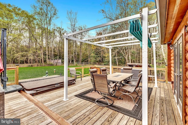 deck featuring a lawn, outdoor dining space, a covered hot tub, and a fenced backyard