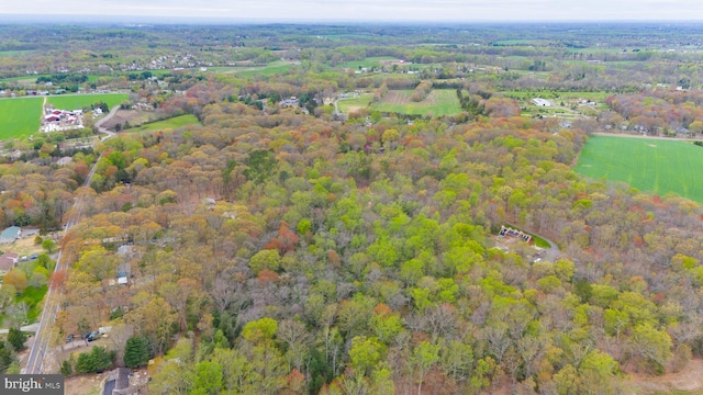 drone / aerial view featuring a forest view