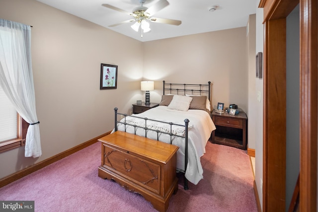 carpeted bedroom featuring a ceiling fan and baseboards