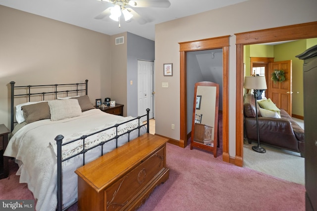 bedroom featuring a closet, a ceiling fan, visible vents, carpet, and baseboards