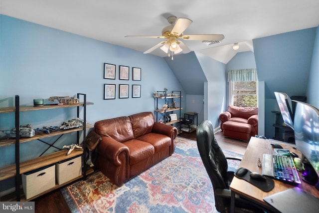 home office with wood finished floors, visible vents, ceiling fan, and vaulted ceiling