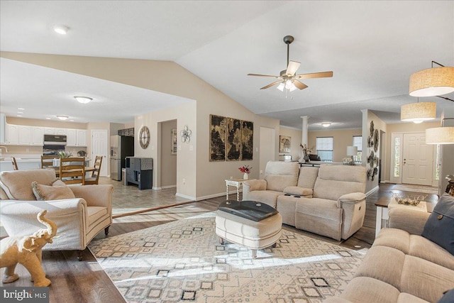 6815 Interlude Pl, Hughesville, MD 20637 - living room featuring ceiling fan, baseboards, vaulted ceiling, and light wood-type flooring