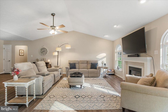 6815 Interlude Pl, Hughesville, MD 20637 - living area featuring baseboards, ceiling fan, a glass covered fireplace, dark wood-style floors, and lofted ceiling