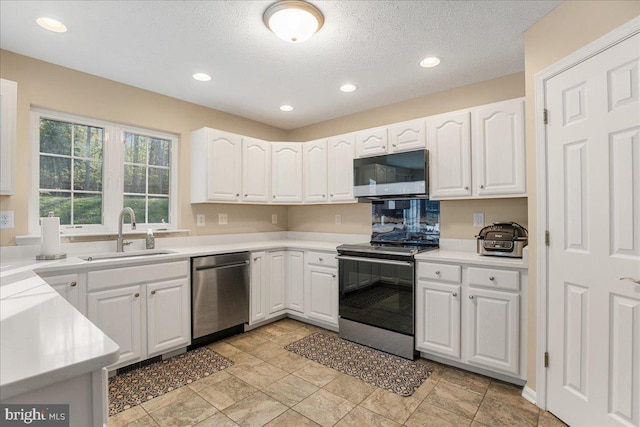 6815 Interlude Pl, Hughesville, MD 20637 - kitchen with white cabinetry, range with electric cooktop, stainless steel dishwasher, and a sink