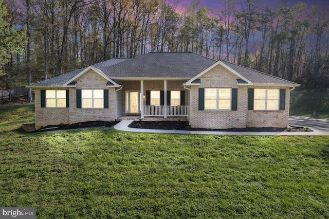 6815 Interlude Pl, Hughesville, MD 20637 - ranch-style home featuring brick siding, a porch, and a front yard