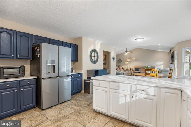 6815 Interlude Pl, Hughesville, MD 20637 - kitchen with a toaster, stainless steel refrigerator with ice dispenser, blue cabinetry, and light countertops