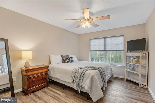 6815 Interlude Pl, Hughesville, MD 20637 - bedroom featuring baseboards, wood finished floors, and ceiling fan