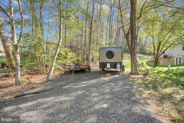 6815 Interlude Pl, Hughesville, MD 20637 - view of vehicle parking featuring a carport and gravel driveway