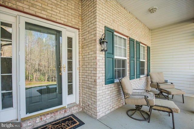 6815 Interlude Pl, Hughesville, MD 20637 - property entrance with a porch and brick siding