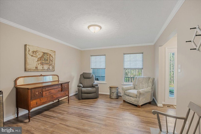 6815 Interlude Pl, Hughesville, MD 20637 - sitting room featuring a textured ceiling, wood finished floors, ornamental molding, and baseboards