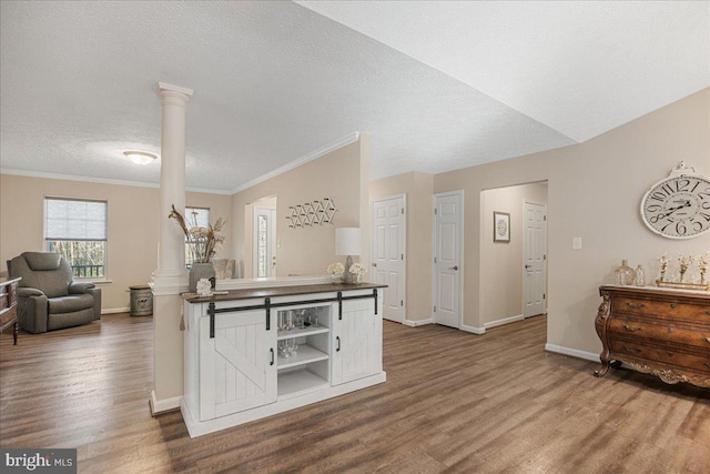 6815 Interlude Pl, Hughesville, MD 20637 - kitchen with ornate columns, dark wood-style flooring, white cabinetry, baseboards, and dark countertops