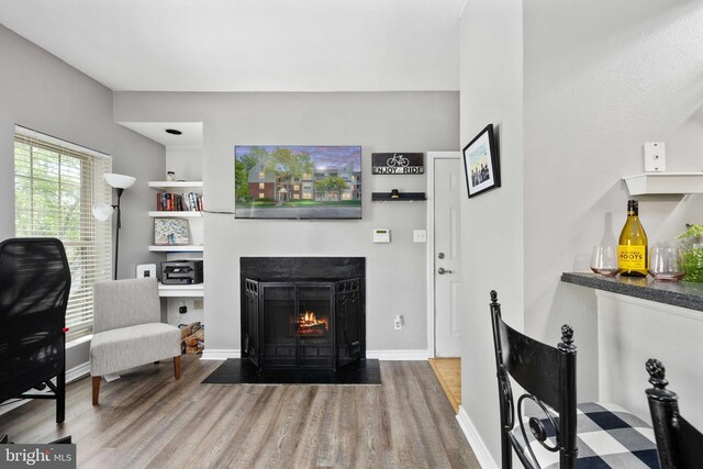 12152 Penderview Ter Unit 1322, Fairfax, VA 22033 - living area with a fireplace with flush hearth, baseboards, and wood finished floors