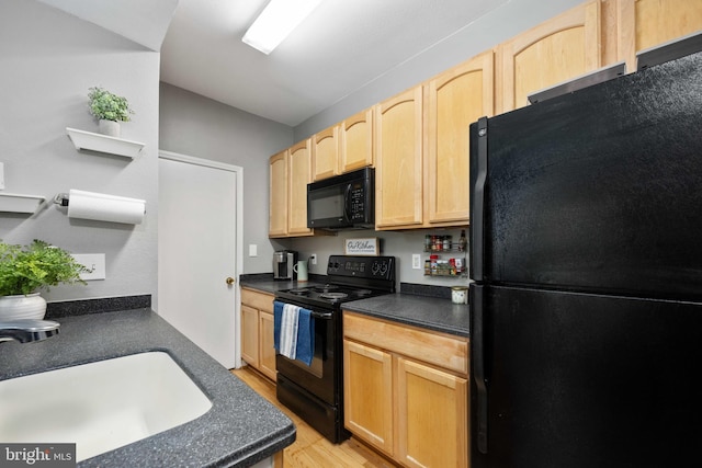 12152 Penderview Ter Unit 1322, Fairfax, VA 22033 - kitchen with dark countertops, light wood-type flooring, a sink, black appliances, and light brown cabinets