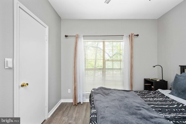 12152 Penderview Ter Unit 1322, Fairfax, VA 22033 - bedroom with baseboards, ceiling fan, and wood finished floors