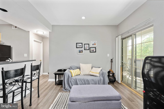 12152 Penderview Ter Unit 1322, Fairfax, VA 22033 - living area featuring light wood-style floors and baseboards