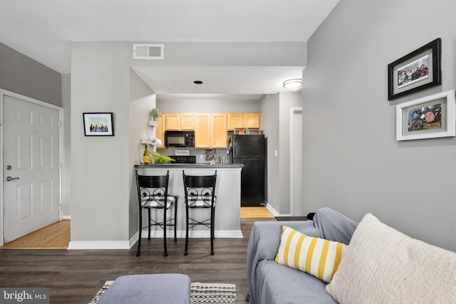 12152 Penderview Ter Unit 1322, Fairfax, VA 22033 - living area featuring baseboards, wood finished floors, and visible vents