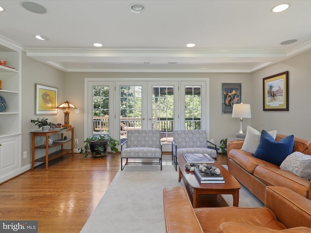 living room featuring ornamental molding, a wealth of natural light, french doors, and wood finished floors