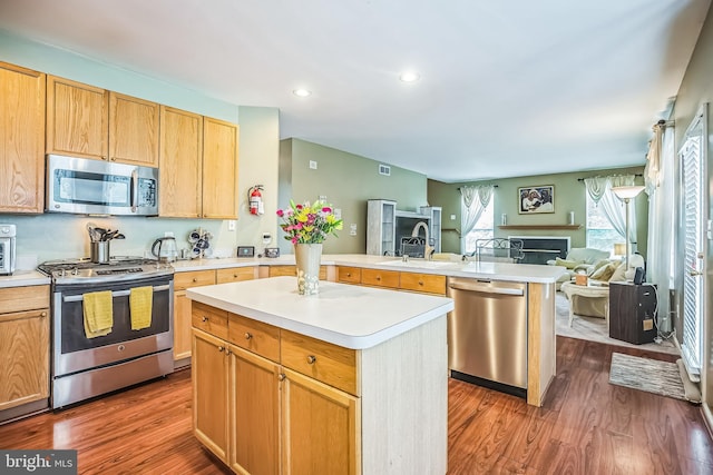 2 Rosebush Ct, Sicklerville, NJ 08081 - kitchen featuring appliances with stainless steel finishes, open floor plan, a peninsula, wood finished floors, and recessed lighting