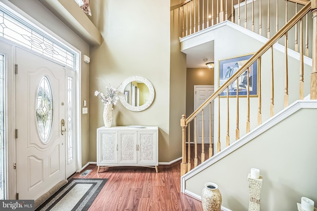 2 Rosebush Ct, Sicklerville, NJ 08081 - foyer featuring stairway, wood finished floors, baseboards, and a towering ceiling