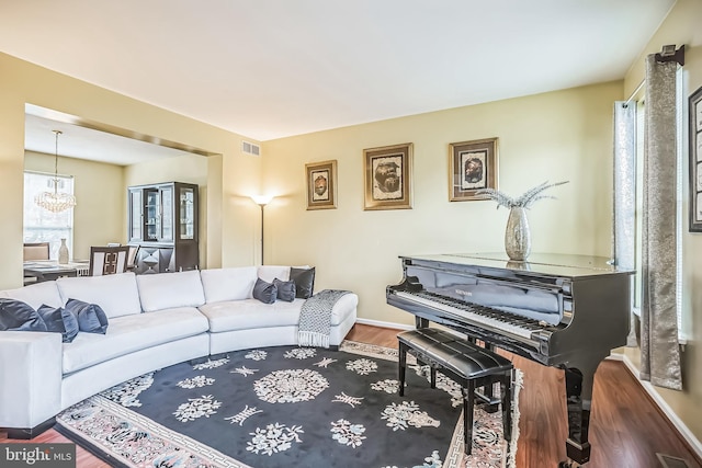 2 Rosebush Ct, Sicklerville, NJ 08081 - living area with healthy amount of natural light, wood finished floors, a chandelier, and baseboards
