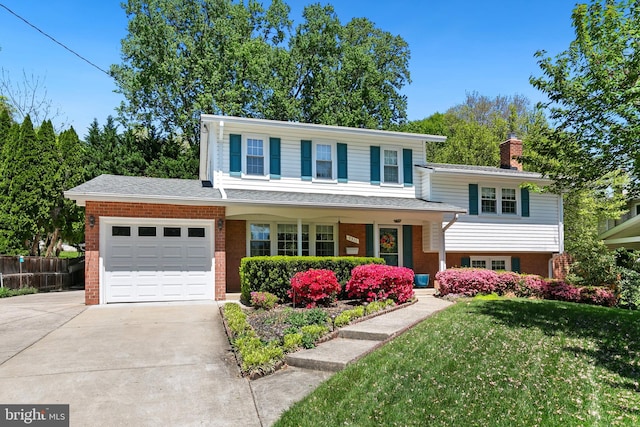 5311 Crestedge Ln, Rockville, MD 20853 - view of front of home with brick siding, driveway, an attached garage, and a chimney