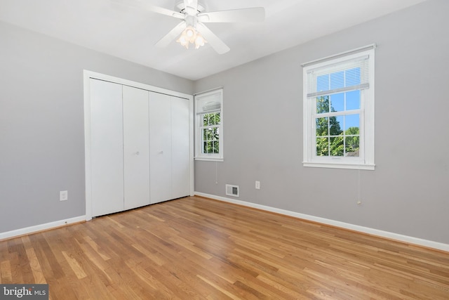 5311 Crestedge Ln, Rockville, MD 20853 - unfurnished bedroom with baseboards, light wood-style flooring, a closet, and a ceiling fan