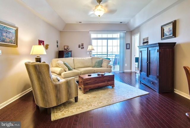 living area featuring baseboards, a ceiling fan, dark wood-style floors, and visible vents