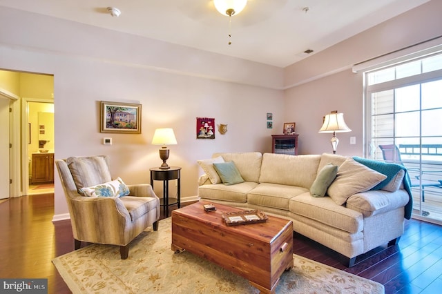 living room with visible vents and wood finished floors