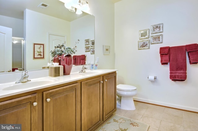 bathroom with visible vents, a sink, tile patterned flooring, and a shower stall