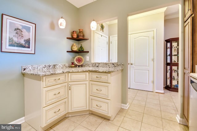 interior space with baseboards, ornamental molding, and tile patterned floors