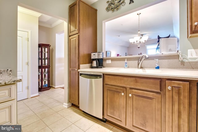 kitchen with crown molding, stainless steel dishwasher, a sink, light tile patterned floors, and a notable chandelier