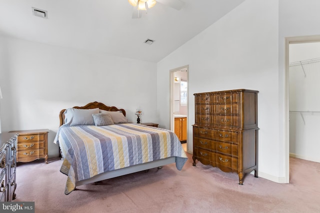 bedroom with light carpet, vaulted ceiling, and visible vents