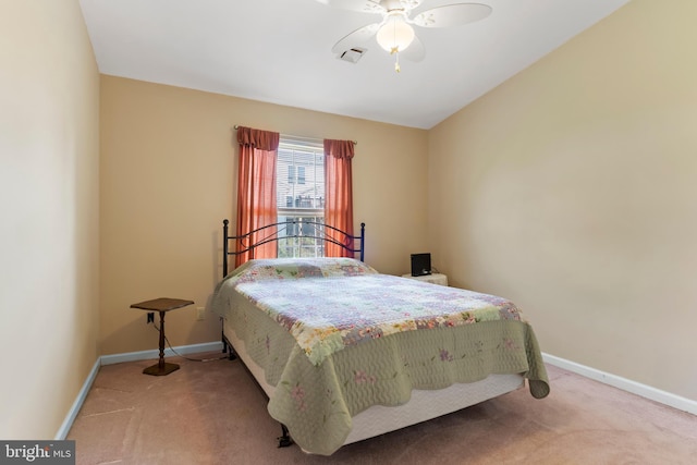 carpeted bedroom with baseboards, ceiling fan, and visible vents