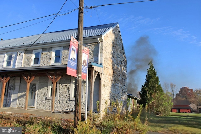 9635 Upper Strasburg Rd, Upperstrasburg, PA 17265 - view of home's exterior featuring metal roof and stone siding