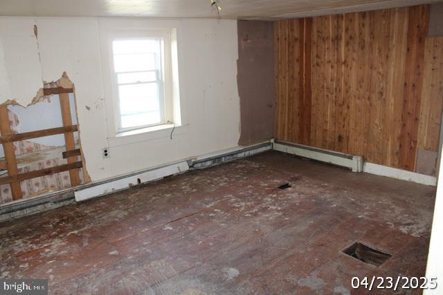 9635 Upper Strasburg Rd, Upperstrasburg, PA 17265 - empty room with visible vents and wood walls