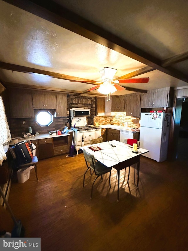 377 Main St, Cedarville, NJ 08311 - kitchen with white appliances, decorative backsplash, beamed ceiling, light countertops, and a ceiling fan
