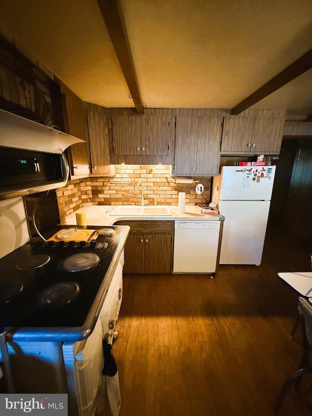 377 Main St, Cedarville, NJ 08311 - kitchen featuring beam ceiling, white appliances, dark wood finished floors, and a sink