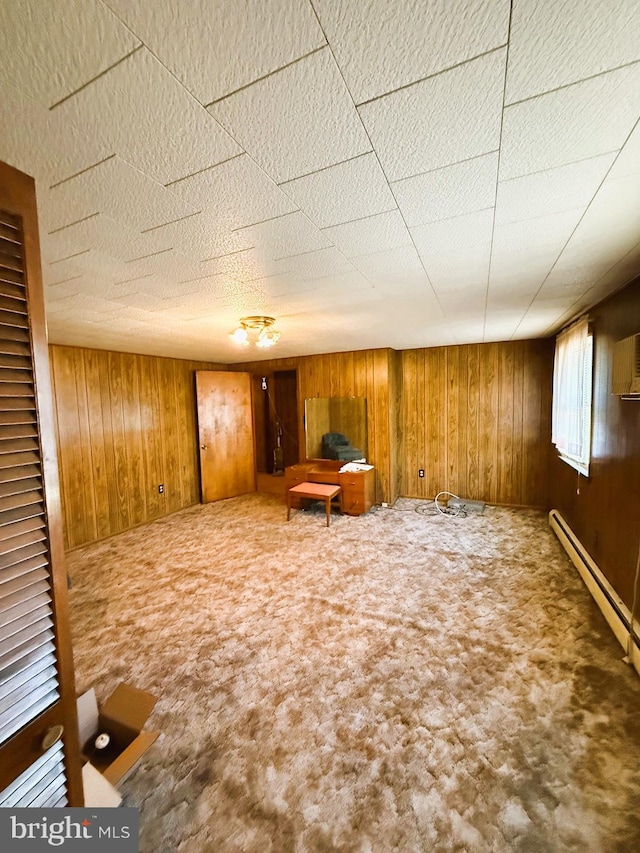 377 Main St, Cedarville, NJ 08311 - interior space featuring wooden walls, carpet floors, and a baseboard radiator