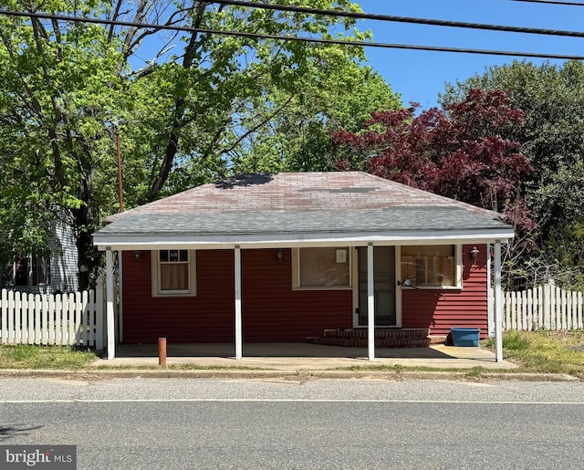 377 Main St, Cedarville, NJ 08311 - view of front of house with fence and roof with shingles