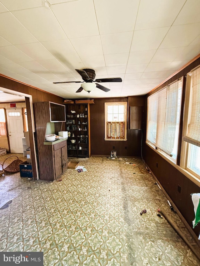 377 Main St, Cedarville, NJ 08311 - unfurnished living room featuring a ceiling fan and wood walls
