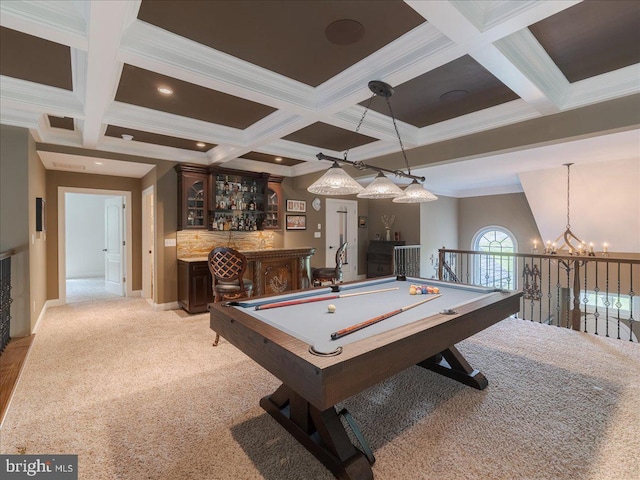 game room with coffered ceiling, light colored carpet, crown molding, beamed ceiling, and indoor bar