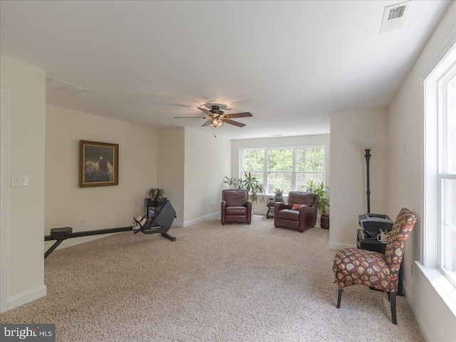sitting room featuring baseboards, ceiling fan, carpet flooring, and visible vents